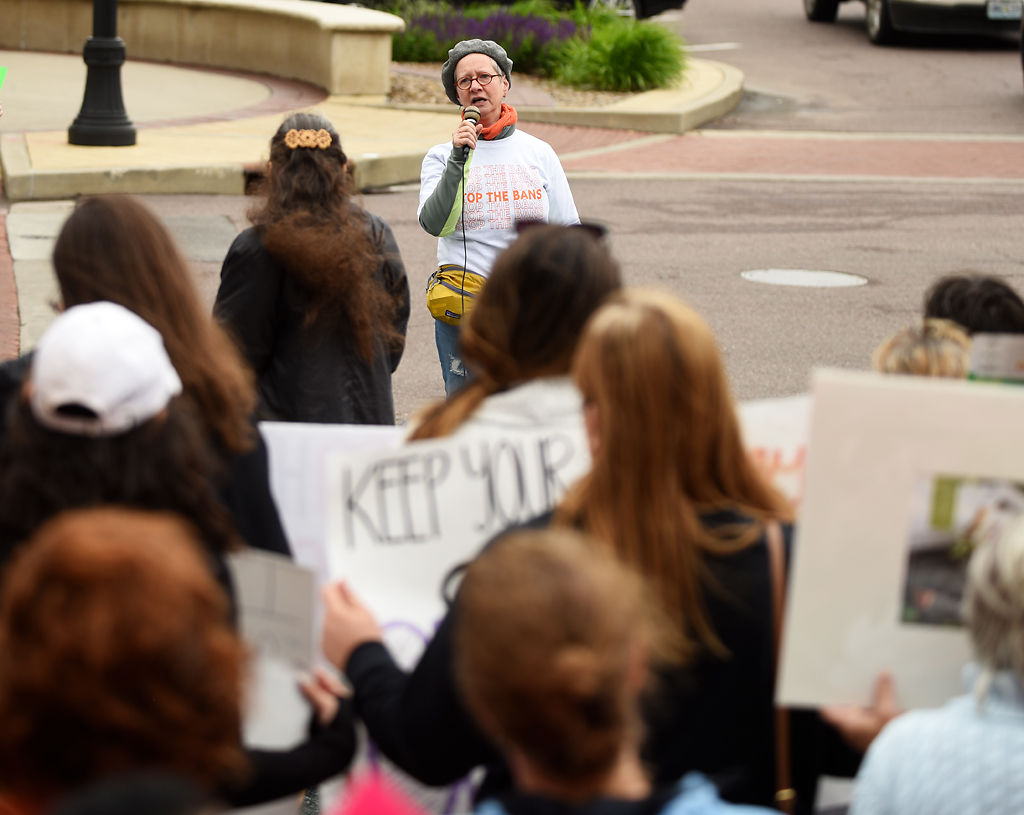Susan Pereira speaks to a crowd